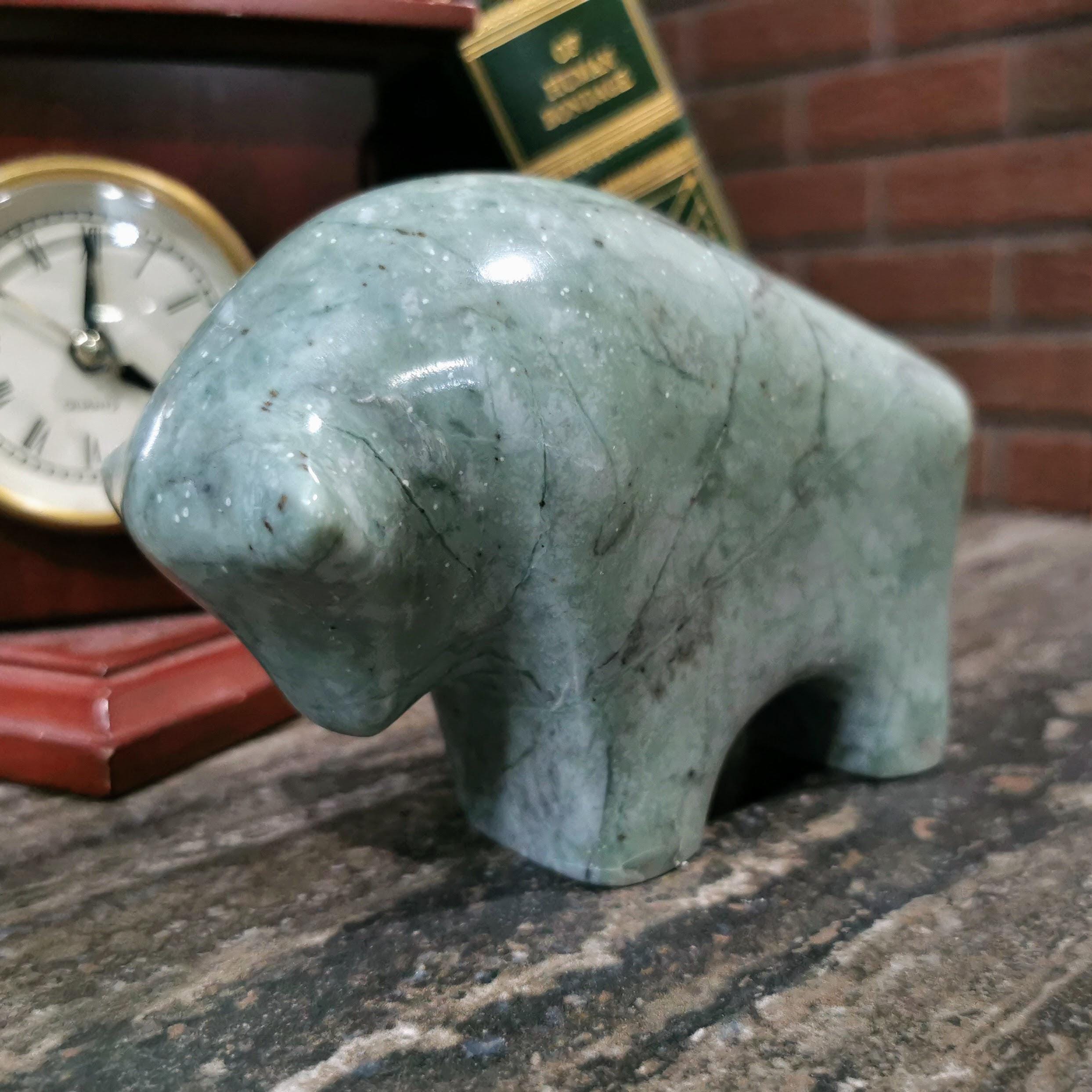 Hand-carved green marble bull figurine with natural veining, unique animal sculpture,
luxury home decor collectible, artisan marble carving
