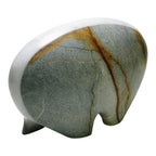 Decorative stone with a white base on a white background