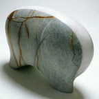 Marble-patterned stone elephant sculpture on a white background