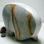 Marble-patterned stone elephant sculpture on a white background