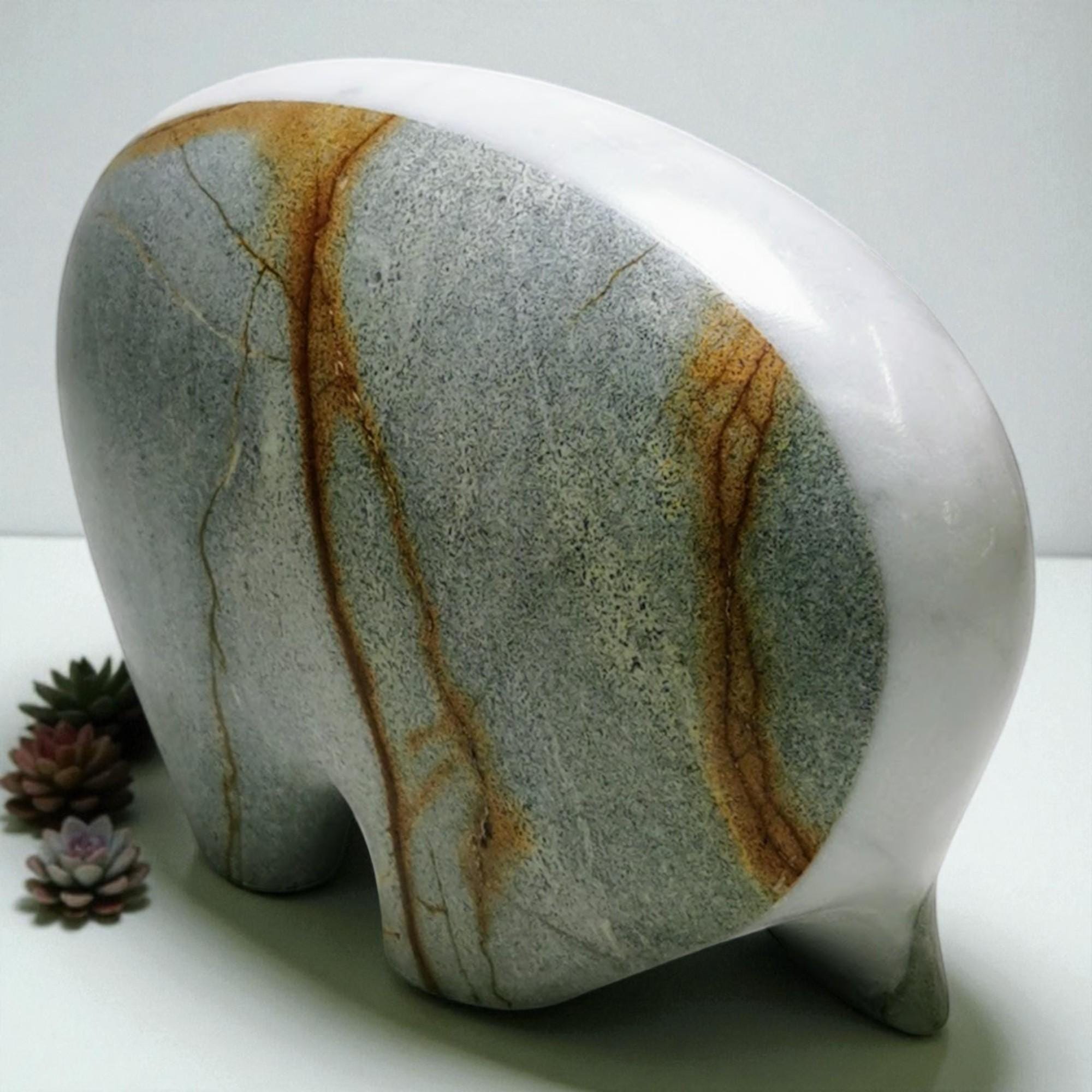 Marble-patterned stone elephant sculpture on a white background