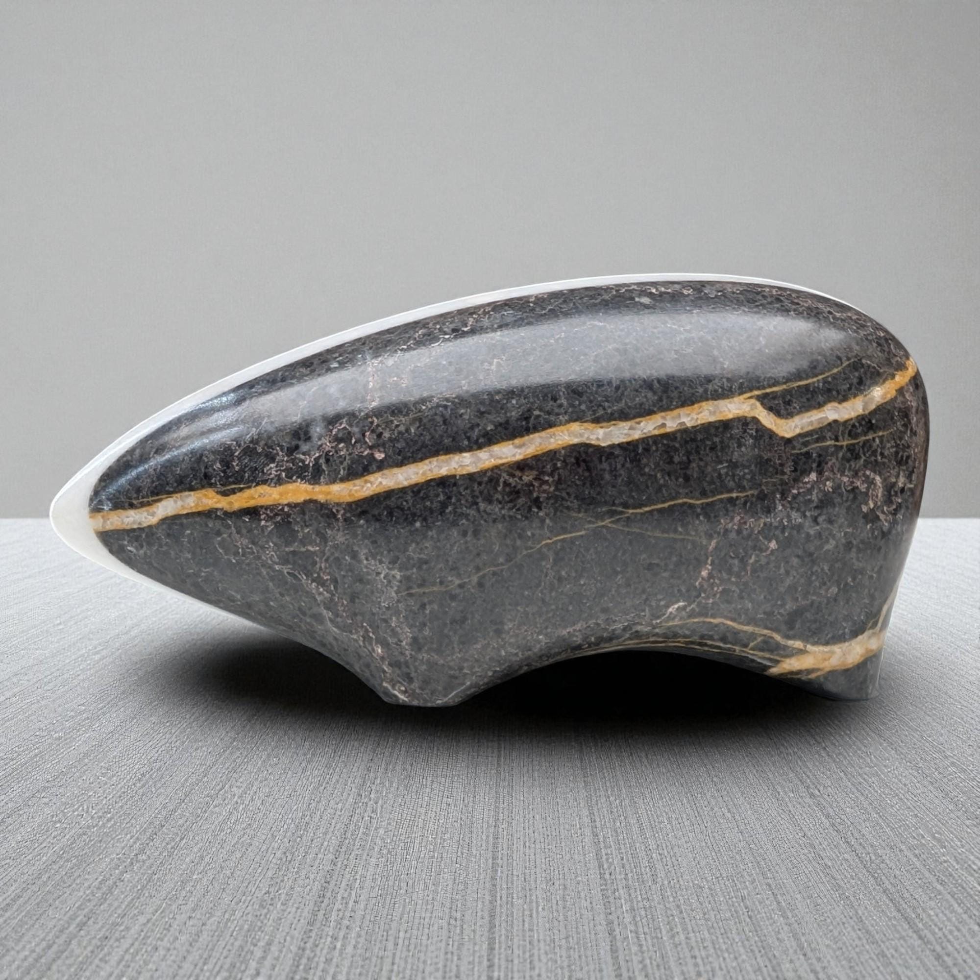 Hand-carved marble badger sculpture with fine animal detail, natural stone coloring,
luxury collectible figurine, artisan home decor piece