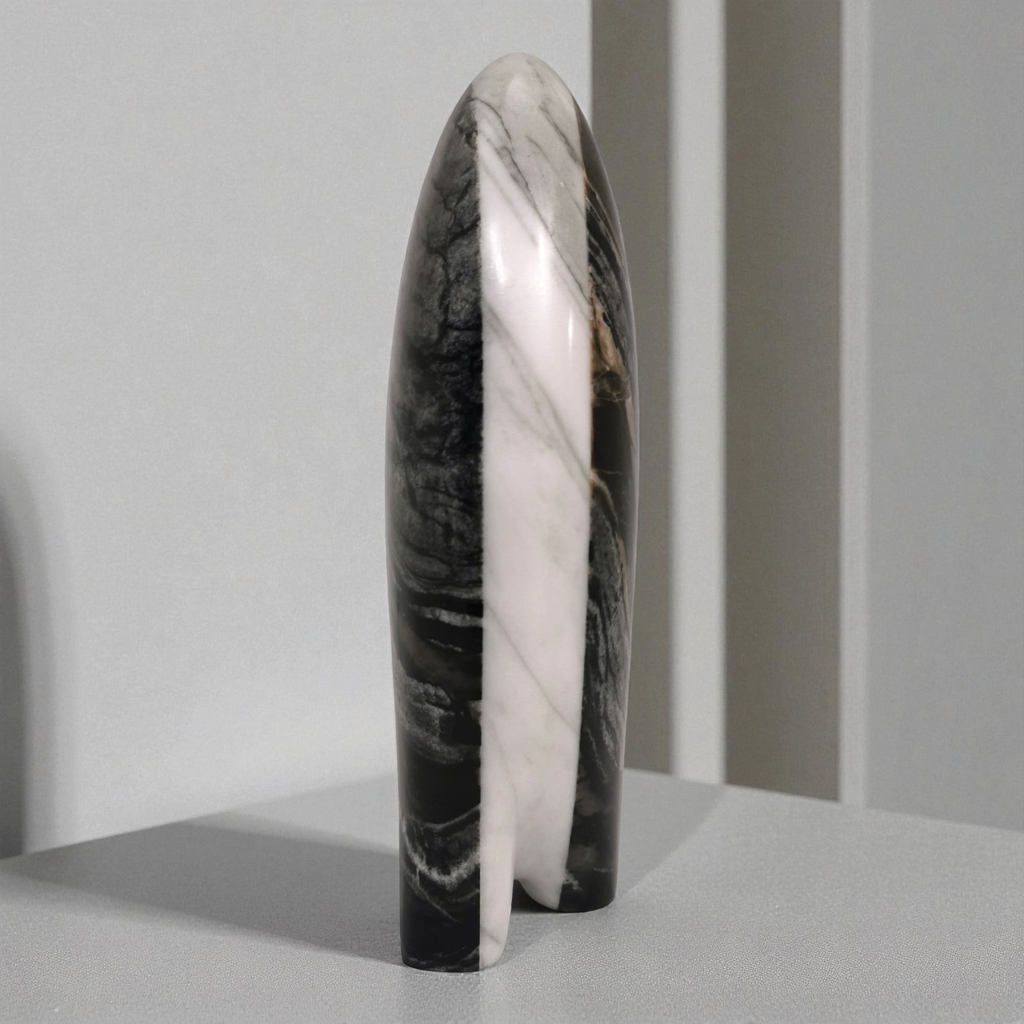 Marble-patterned cylindrical object on a gray background