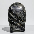 Marble-like stone sculpture on a white background