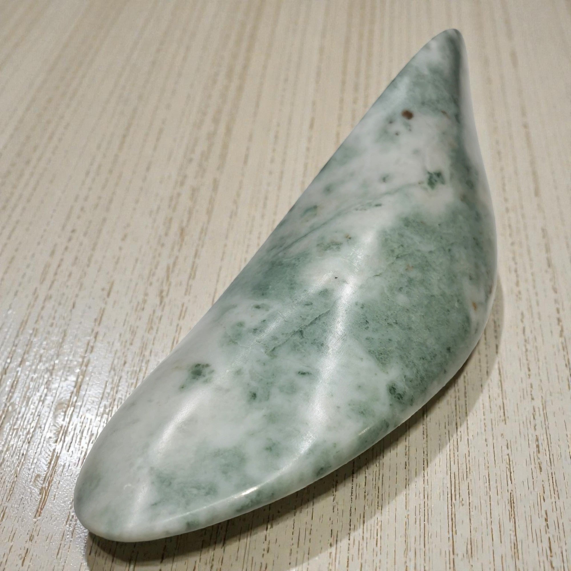 Leviathan hand-carved abstract marble sculpture with flowing organic form, dark gray
stone, luxury contemporary art home decor, artisan-crafted