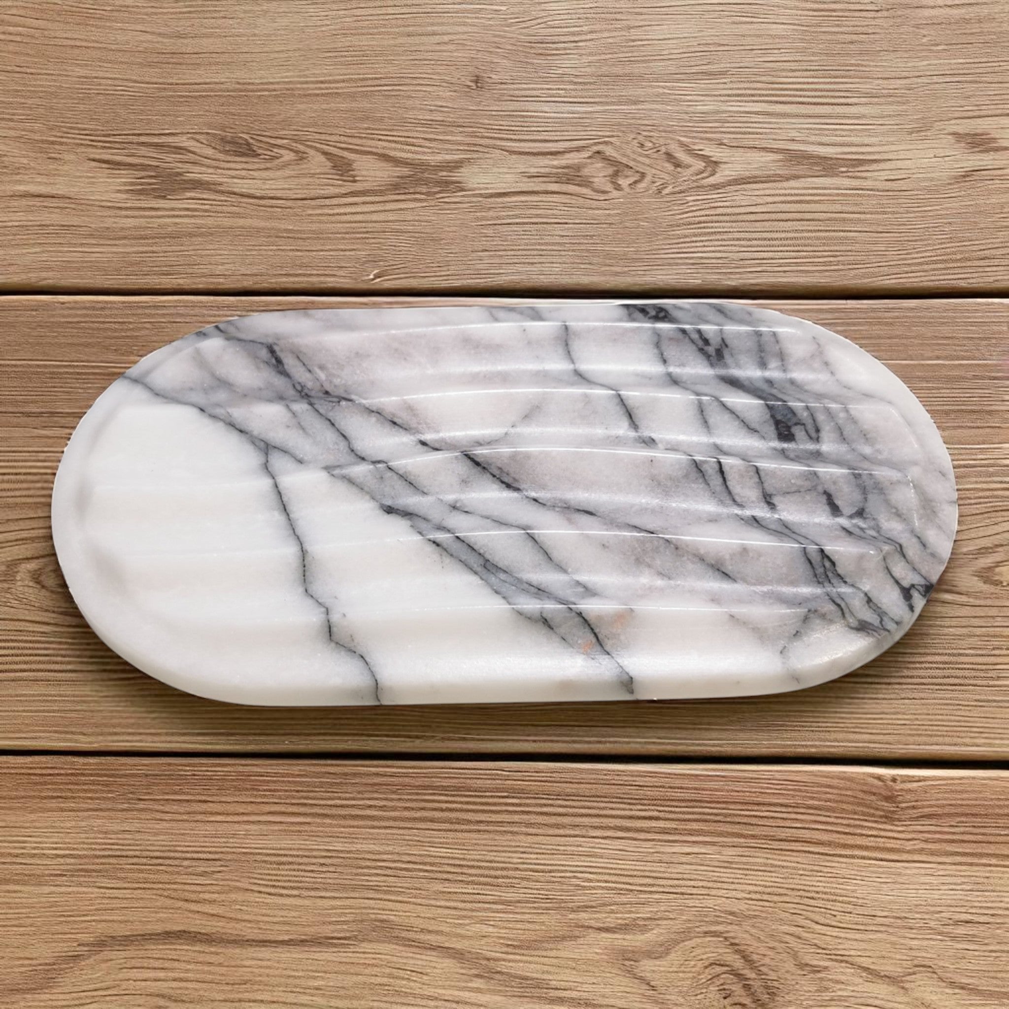 Marble-patterned cutting board on a wooden surface