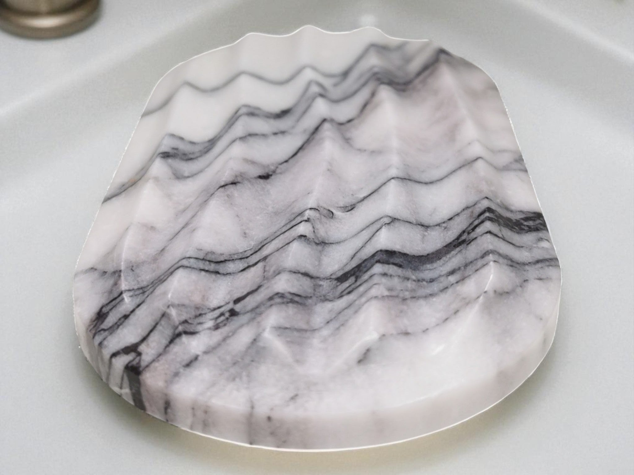 Marble-patterned cutting board on a white surface