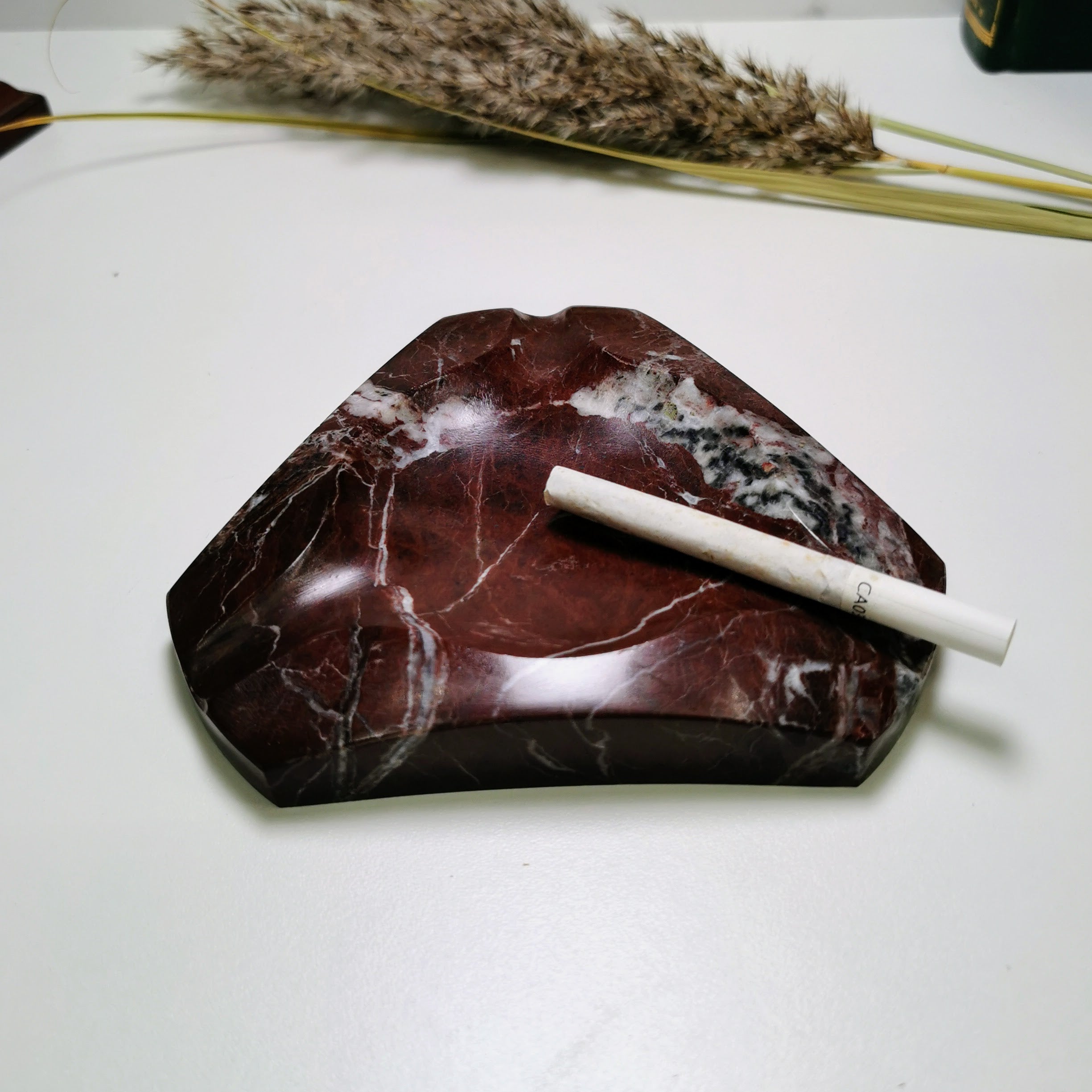 Solid red and black marble geometric ashtray with white veins