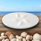 On a wooden surface with seashells and a blue sky background
