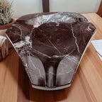 Marble-patterned vase on a wooden surface