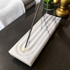 White marble incense holder with modern ash catcher design, polished surface,
meditation home spa decor, luxury aromatherapy accessory