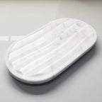 White rectangular cushion on a light gray background