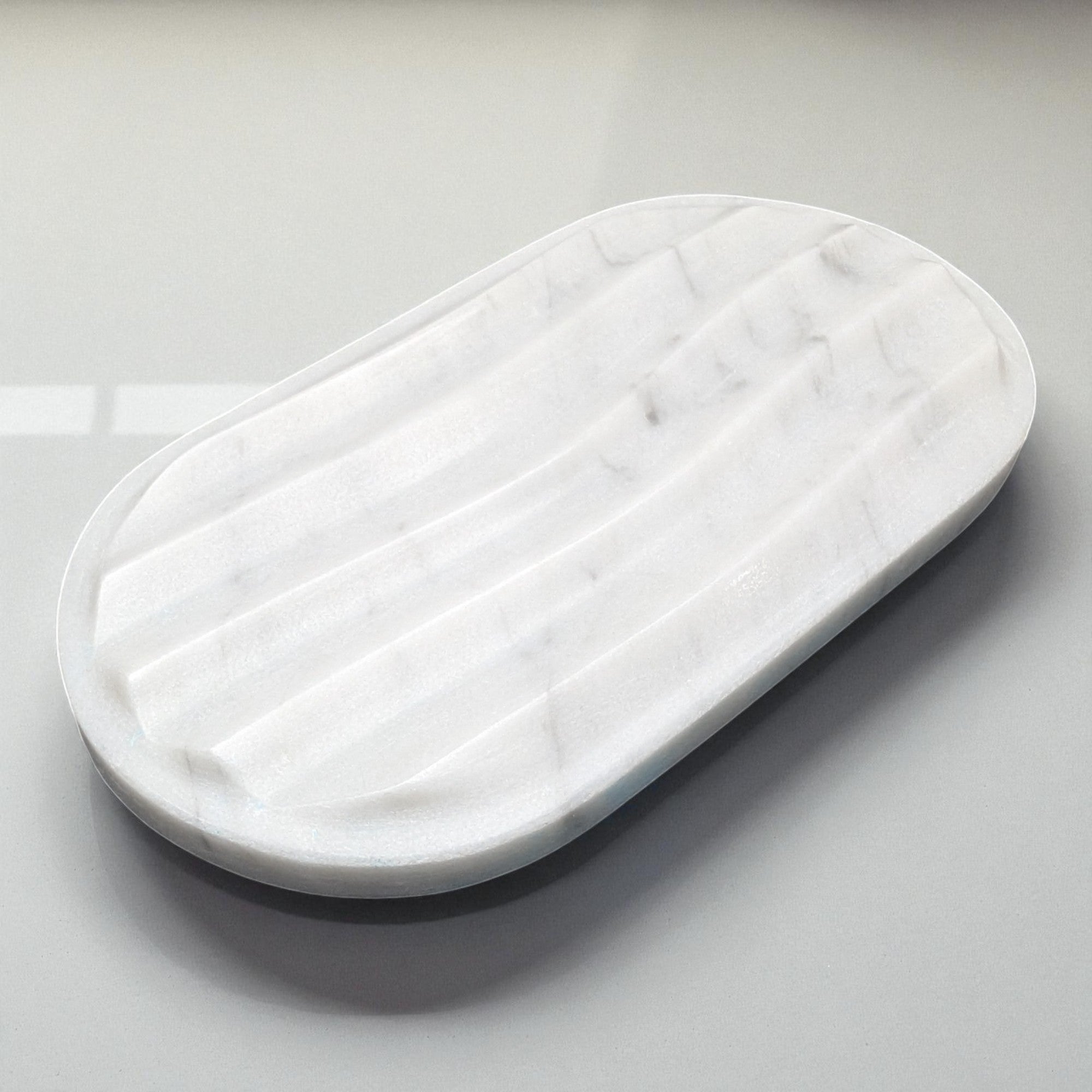White rectangular cushion on a light gray background