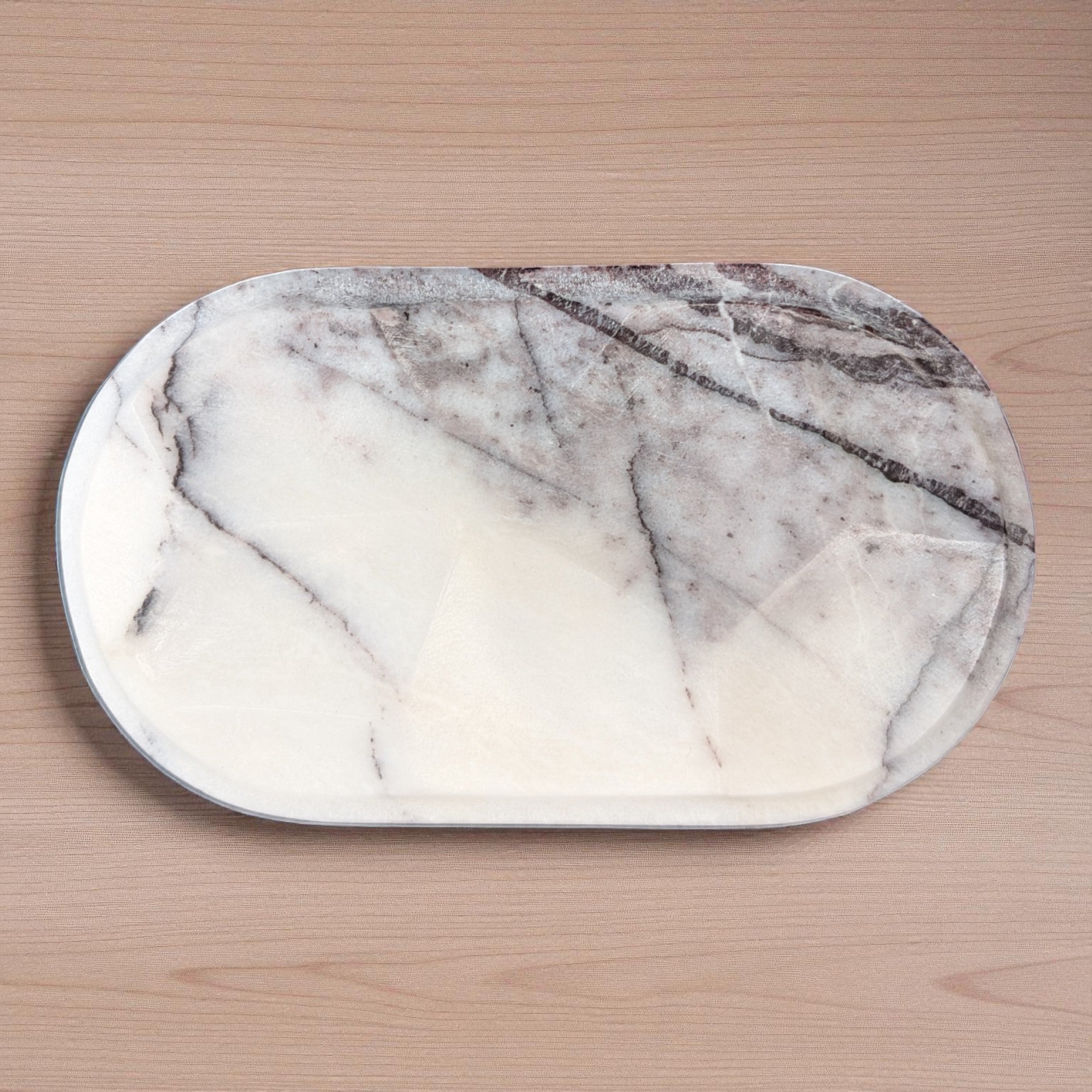 Marble-patterned cutting board on a wooden surface