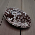 Marbled stone on a wooden surface