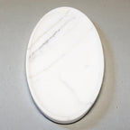 Marble-patterned oval stone on a gray background