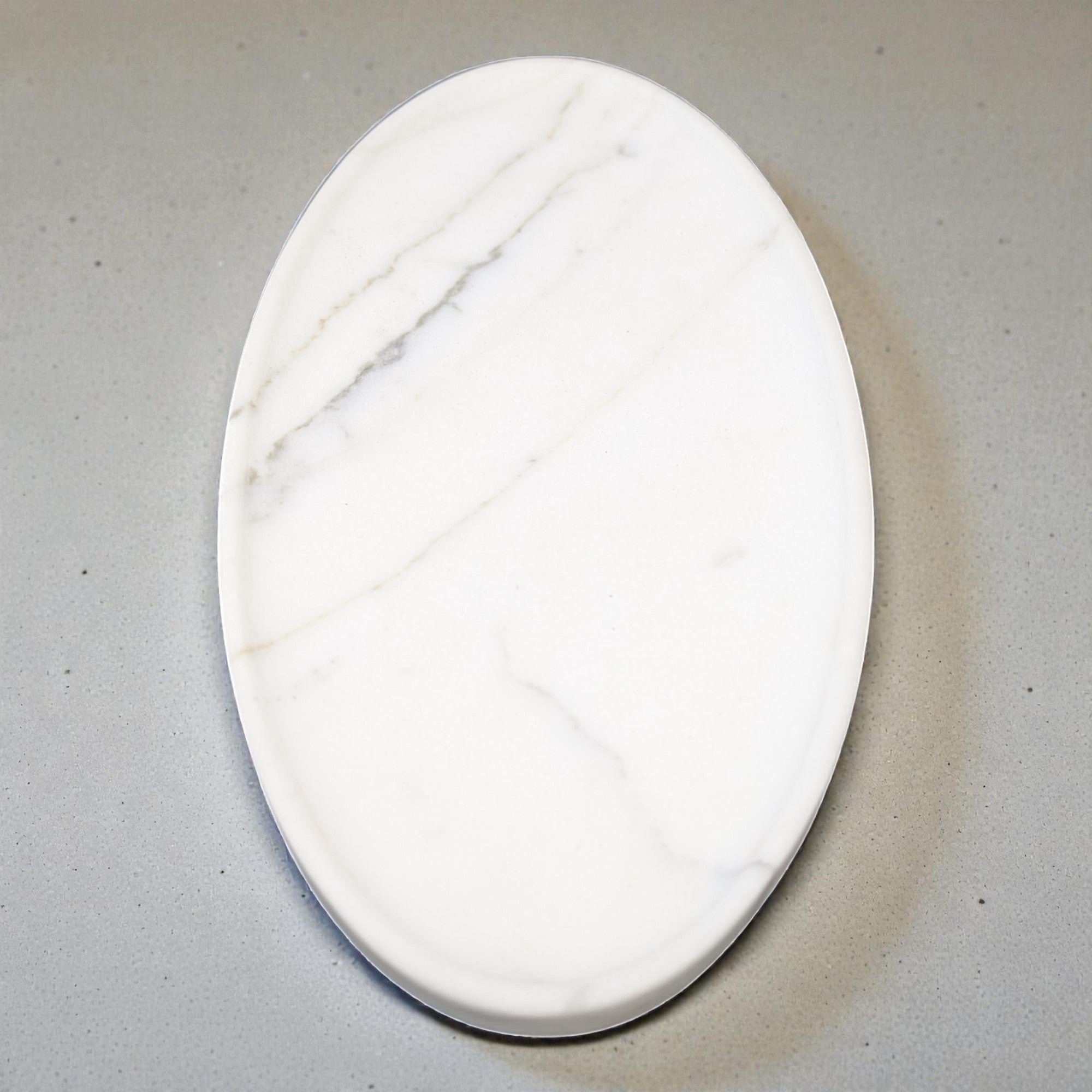 Marble-patterned oval stone on a gray background