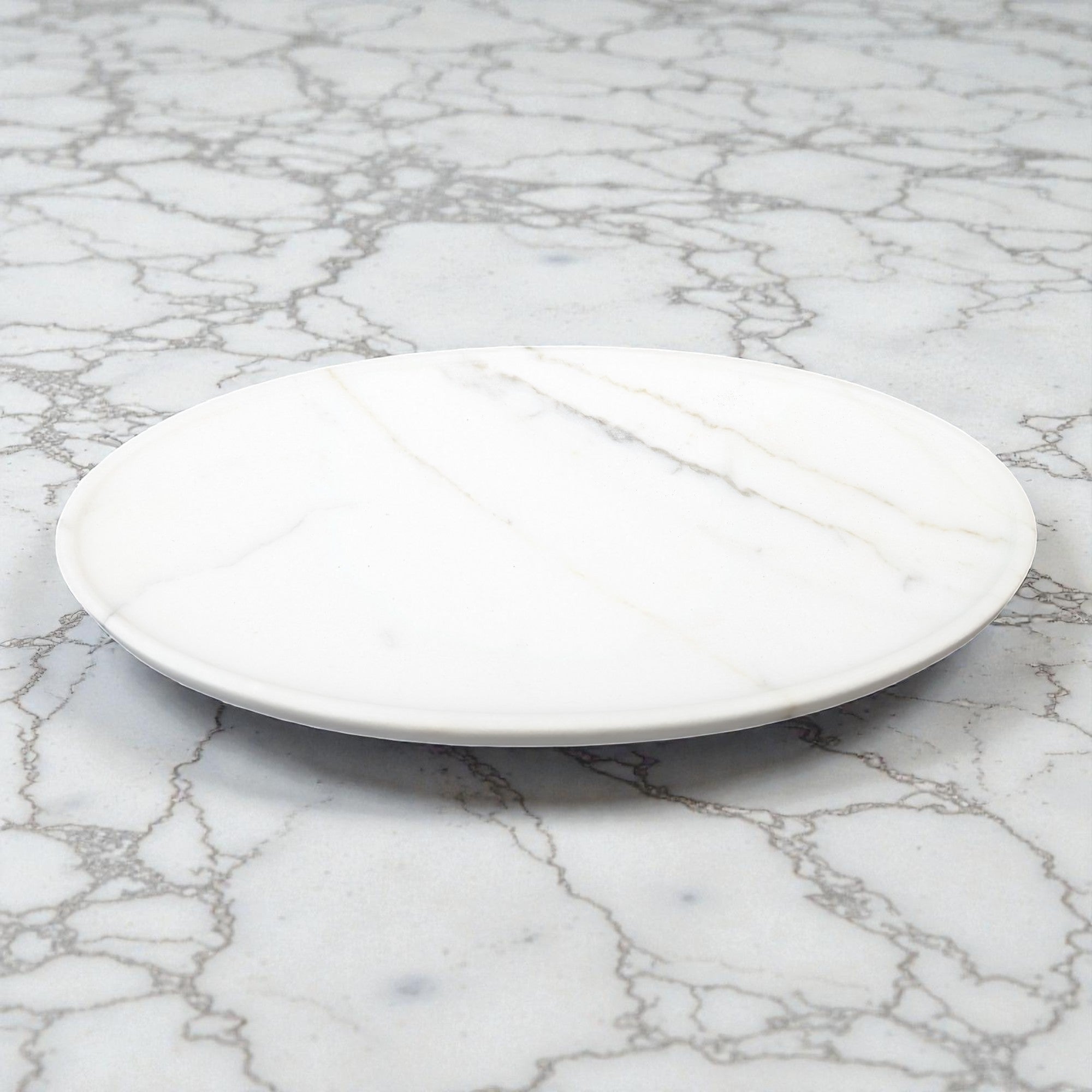 White ceramic plate on a marble surface