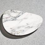 Marble-patterned stone on a gray surface
