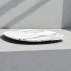 Marble-patterned plate on a gray surface