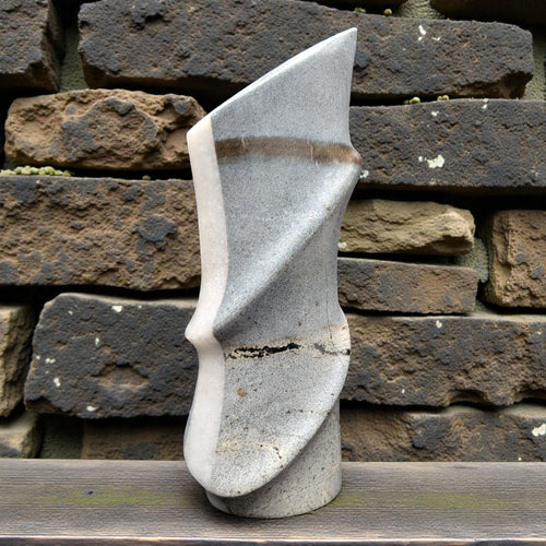 Melted tower abstract marble sculpture with flowing organic form, smooth polished
surface, luxury contemporary art home decor, hand-carved
