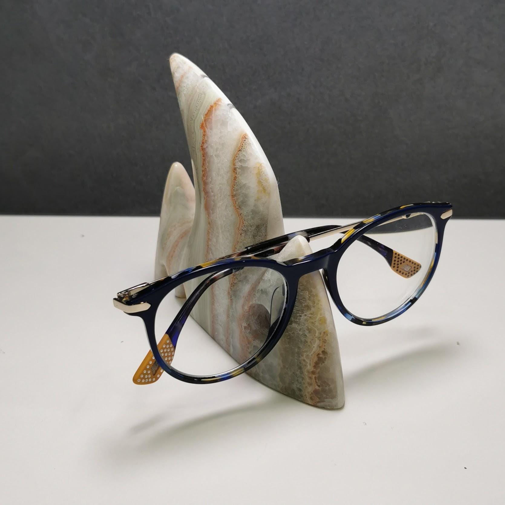 Sail fin eyeglass holder stand with sculptural form, natural stone construction, unique
glasses display, luxury home decor, artisan-crafted
