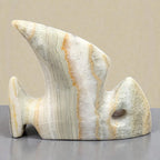 Decorative stone sculpture on a neutral background